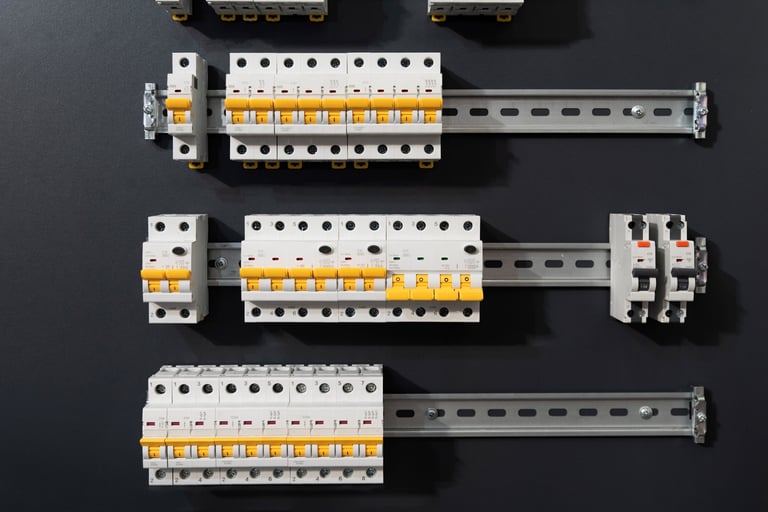 Modular circuit breakers with yellow switches on DIN rails